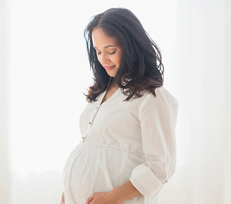 Pregnant Woman Smiling_edited.jpg
