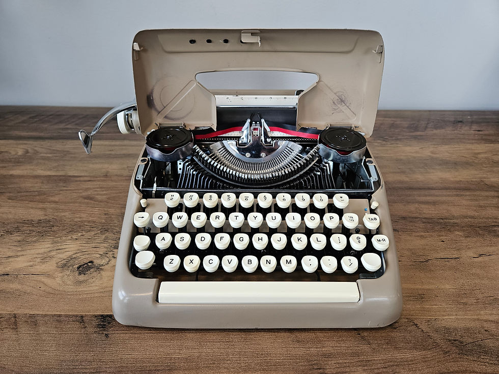 Thumbnail: typewriter front view with ribbon cover open