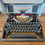 Thumbnail: typewriter front view with ribbon cover open