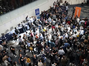 Overhead view of professionals networking at an industry conference, highlighting career-building connections in the energy and chemical sectors.