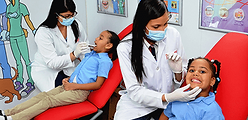 dentist working on children teeth