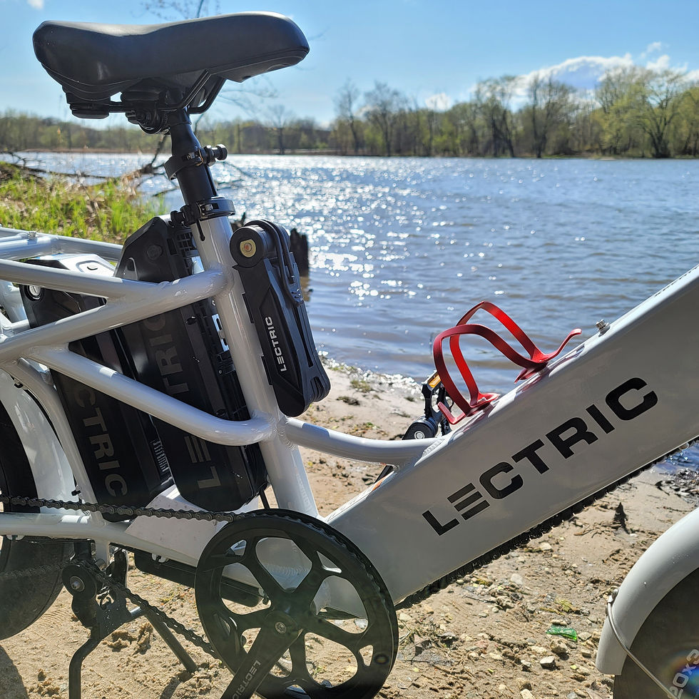 Picture a serene day as a man embarks on a fishing adventure, towing his Lectric cargo bike to a tranquil spot. The cargo bike, equipped for both practicality and leisure, carries fishing gear with ease. Halfway to his destination, the man takes a leisurely break on a bench, the electric cargo bike parked nearby, creating a moment of rest and anticipation for the angler. The ambient sounds of nature accompany this picturesque scene, capturing the essence of a peaceful escape, where the Lectric cargo bike seamlessly integrates into the joy of outdoor activities. It's not just a bike; it's a companion on the journey to relaxation and recreation.