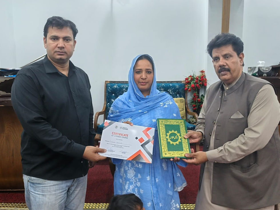 The graduates receive their certificates and a large-print Urdu Bible. Here the presentation is made by teachers Waris and Sikendar.
