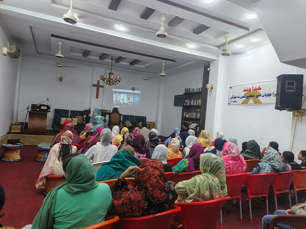 The students address their attention to RTN participants from the U. S. as they hear the words in English and patiently for the translation into Urdu.