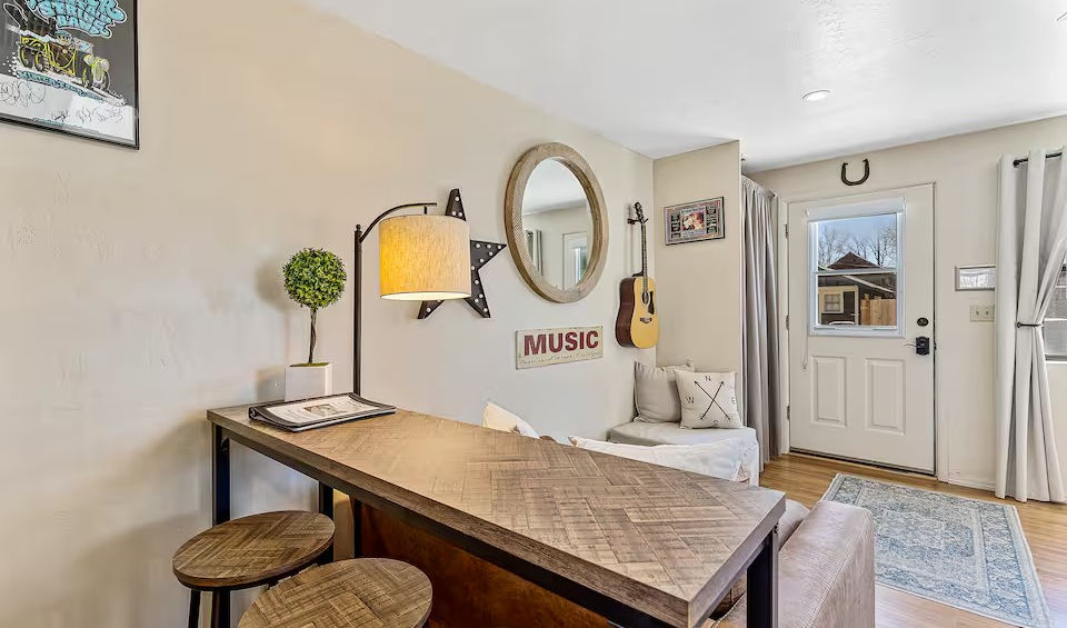 flagstaff-music-studio-guesthouse-bar-dining-table-music-sign-guitar-decor-entry-door.jpg