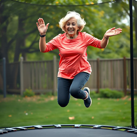 A woman in her 70s jumping on a trampoline.
