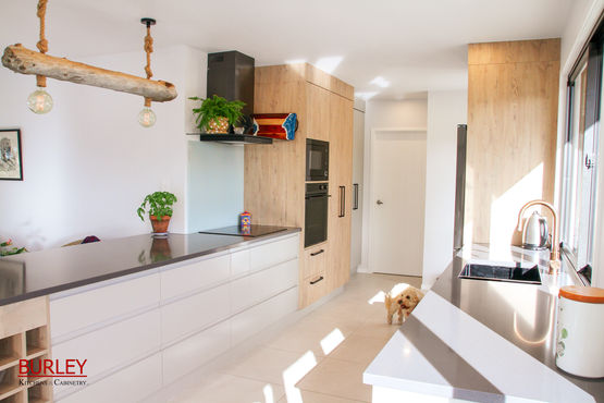 Sunny new kitchen with fingerpull cabinets