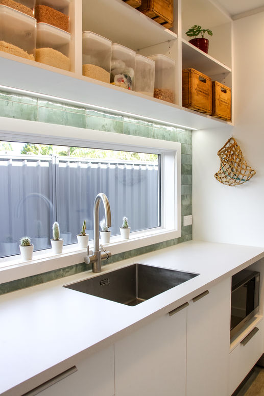 Combined laundry and scullery made by Burley Kitchens with open shelving