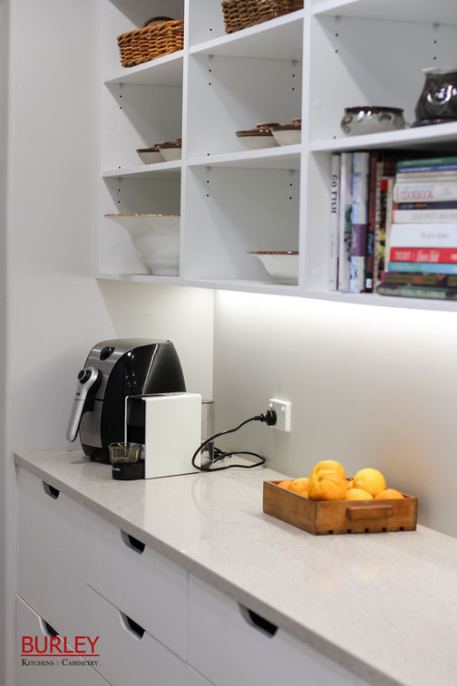 White scullery with open shelves and drawers