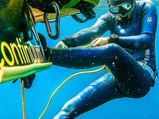 Freediving instructor training on depth line with buoy in open water Taiwan