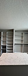 walk in closet with drawers and grey edges