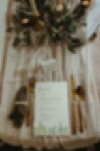 Hand made wedding menu card, ivory and taupe runner, sage green cheese cloth napkin with natural wood bead napkin ring and gold flatware