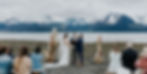 Alaska ocean side wedding ceremony with boho details. Seward, Alaska mountain backdrop at Resurrection bay. Best Alaska venue ideas with wedding planning services.