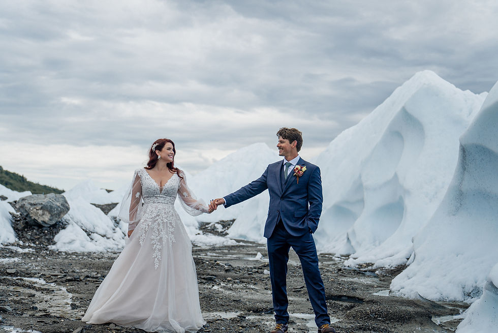 Dramatic glacier peaks are the perfect backdrop for Alaska elopement couple to celebrate their marriage ceremony