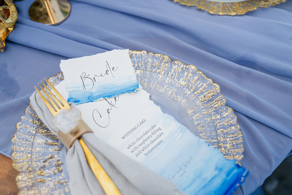 Hand painted wedding cake menu with custom geode napkin rings