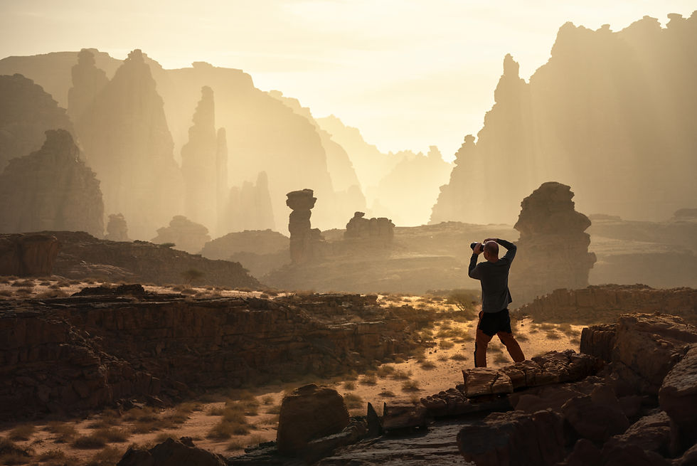 Photographer capturing desert light and sandstone formations in Al Disah Valley during the Saudi Arabia Photo Tour