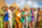 Guests outside giant tipis at festival wedding