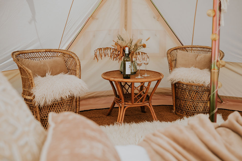 Bell tent interior with chairs and table in wedding tent