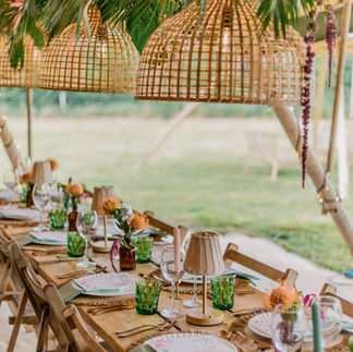 Hanging rattan lanterns inside a tipi