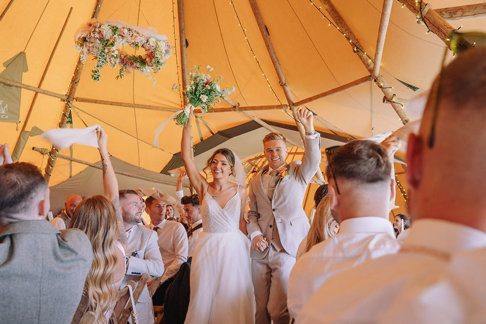Bride and gro
om at tipi wedding reception 