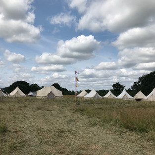 Bell tent village with festival flags