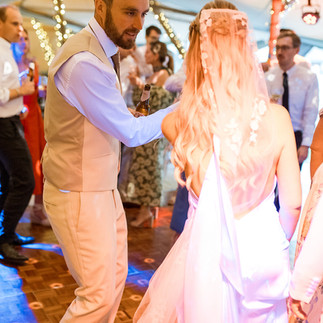 Bride and groom on dancefloor at tipi wedding