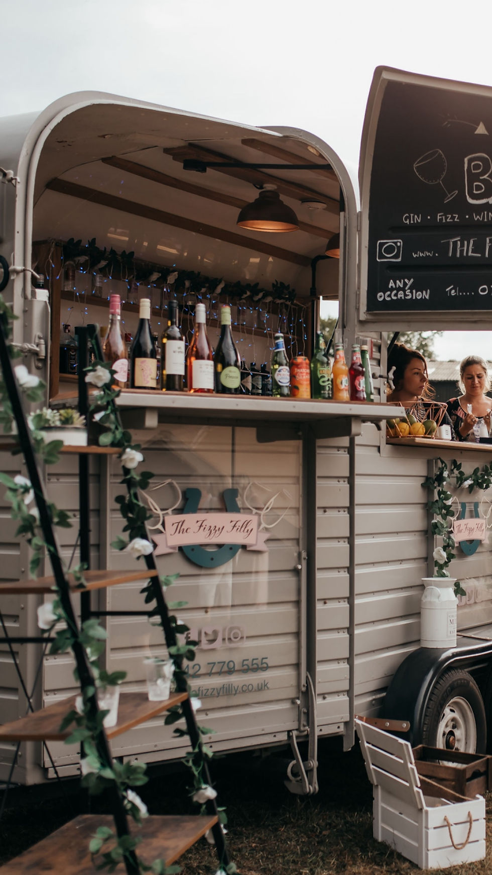 Outdoor horsebox bar at wedding