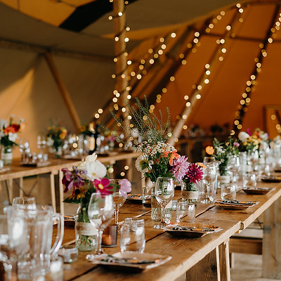 Tipi decor - rustic wooden tables and benches