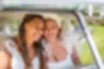 Two brides in a VW campervan at wedding