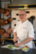 Professional French chef teaching authentic French cooking techniques online