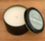 Open 8 oz Driftwood soy candle tin on a wooden surface