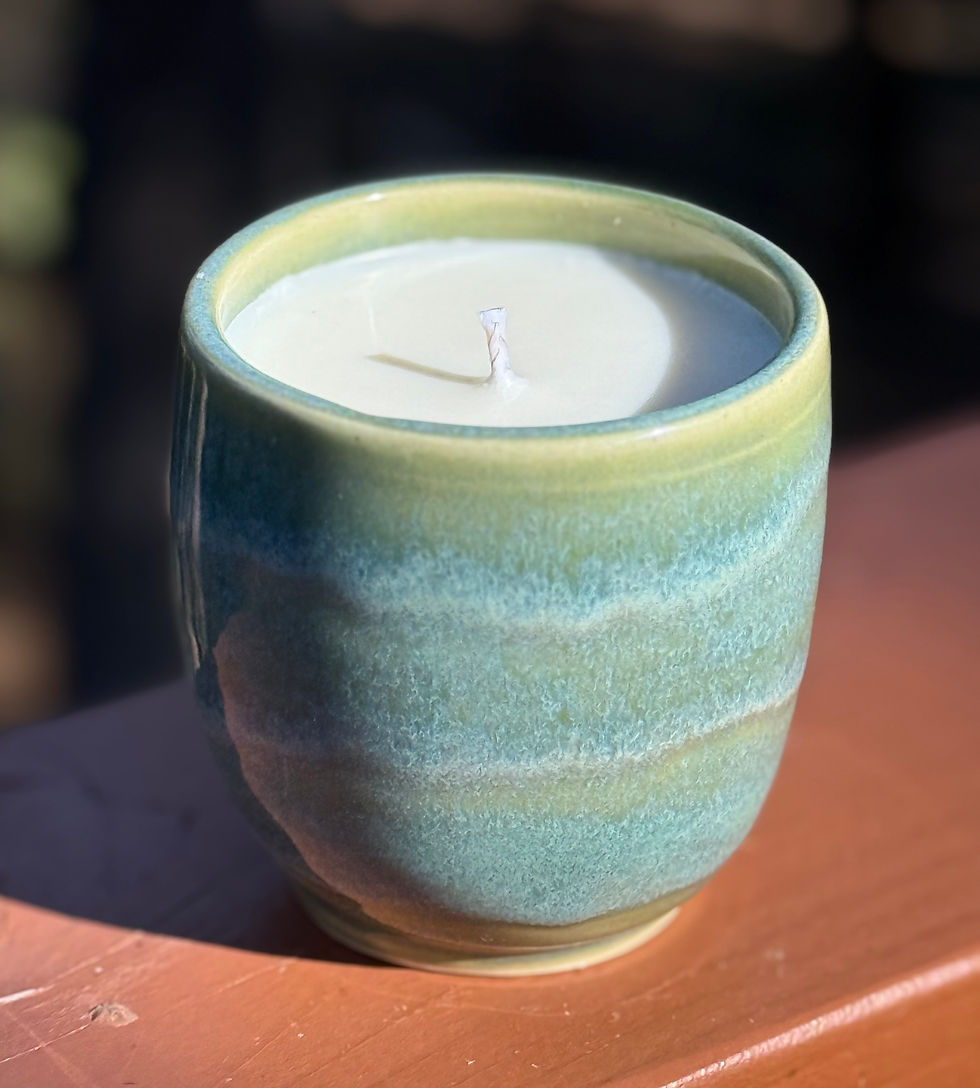 Thumbnail: Handmade ceramic candle in a jade green glazed pot.