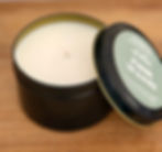 Plum Woods 8 oz soy candle in a black tin with lid