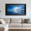 Thumbnail: Eternal Tide framed seascape painting by Ben Goymour hanging above a beige corner sofa in a bright, minimalist living space.