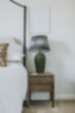 Kids bedroom ideas featuring a green lamp and nightstand.