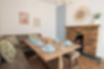 Airbnb interior design for a dining room with brick fireplace