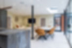 Industrial kitchen design with open plan dining area.