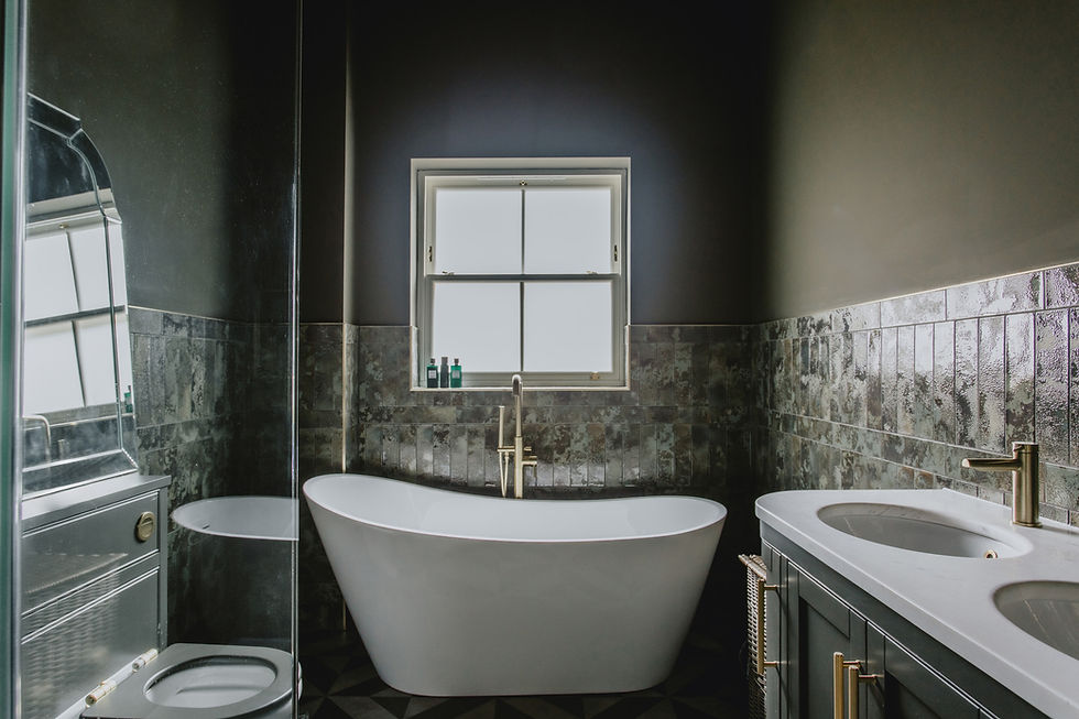 Modern residential interior design featuring a white tub.