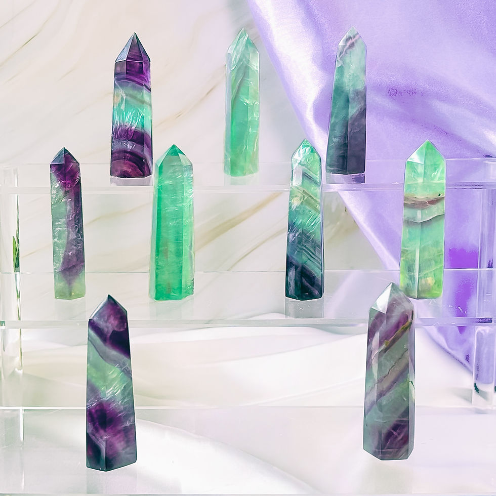 Group of Green & Purple Fluorite Crystal Points – 3" Polished Mini Towers on a clear display with purple silk.