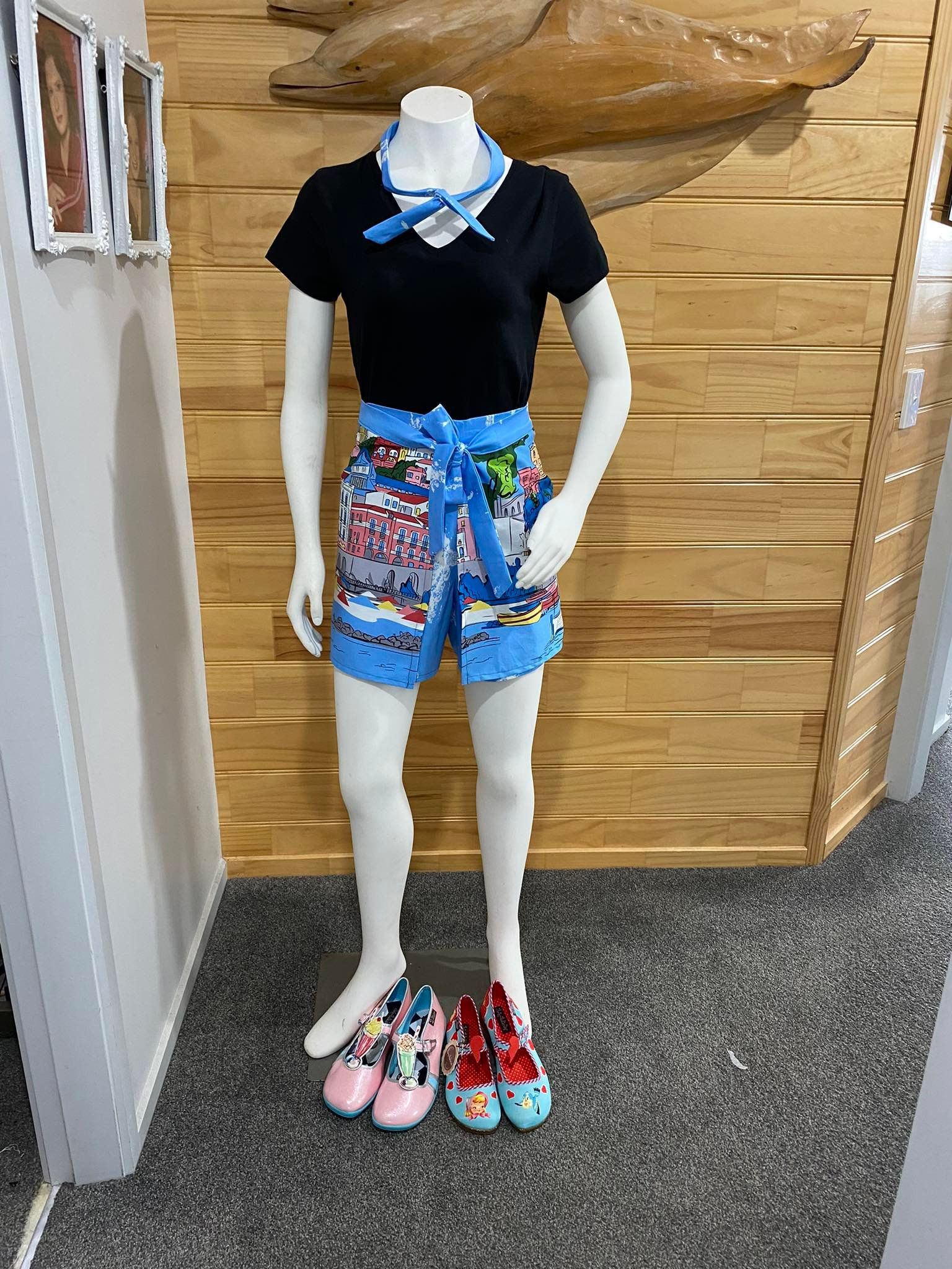 Blue & multi coloured Riveria buildings & sea & lemons.  1st View