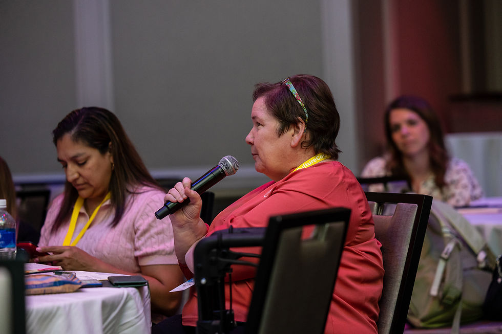 Attendee asking a question while listening to Emily Mabie of Zapier on stage at CultureCon 2026 in Madison, WI