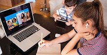Classroom: students collaborating on a computer