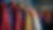 Eye-level view of a vibrant Brazilian Jiu-Jitsu uniform hanging on a rack