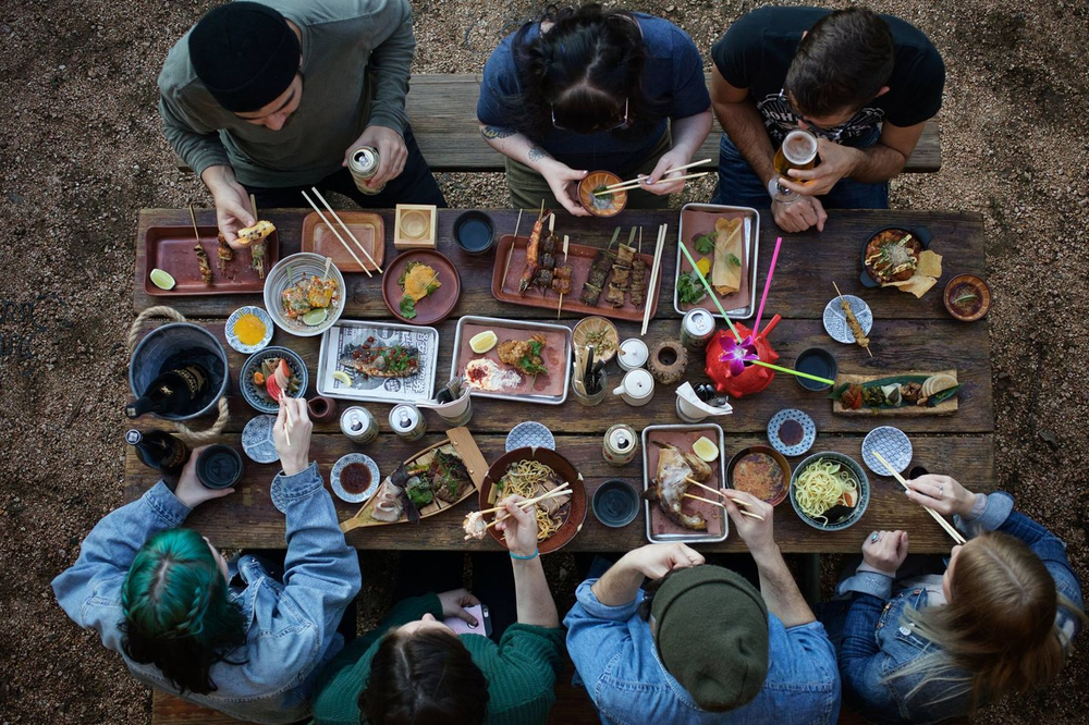 People enjoying food at Kemuri Tatsu-ya in Austin, TX