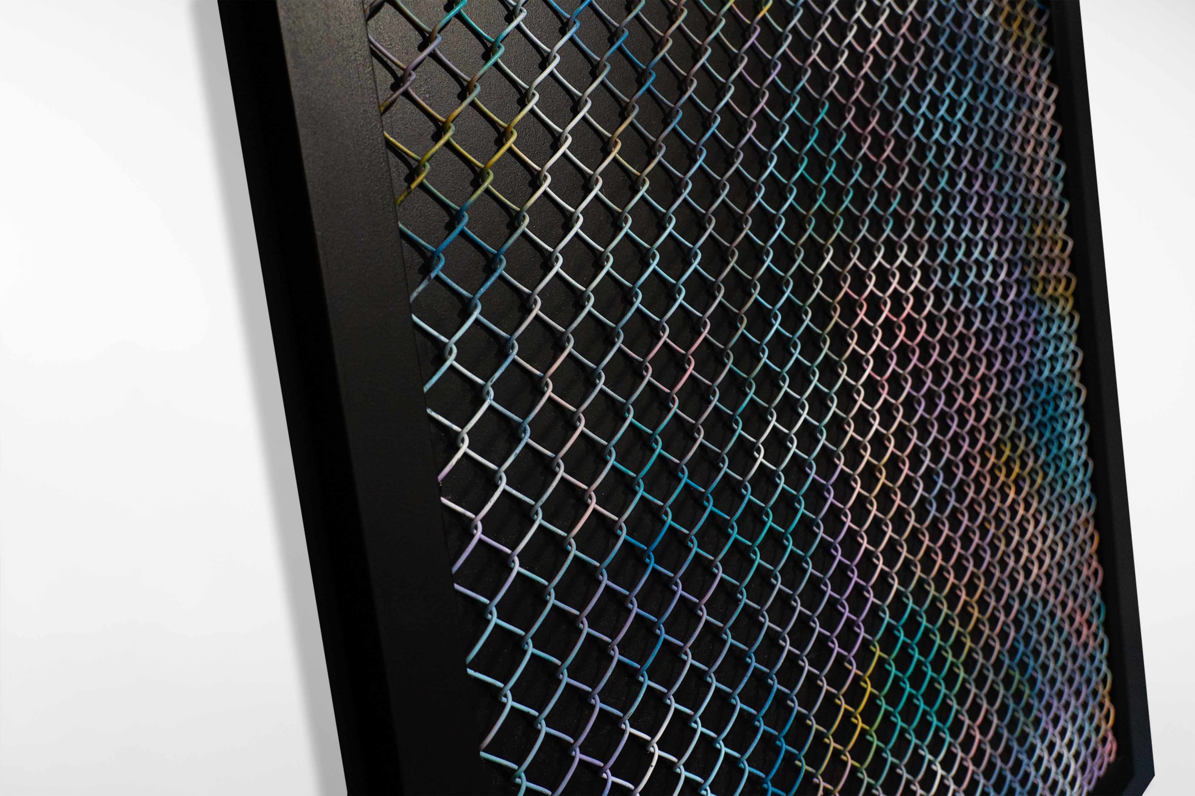 Detail view of a mixed media artwork by Cameron Hunt, showing multicoloured diamond-patterned wire fencing layered over a dark, softly textured background.