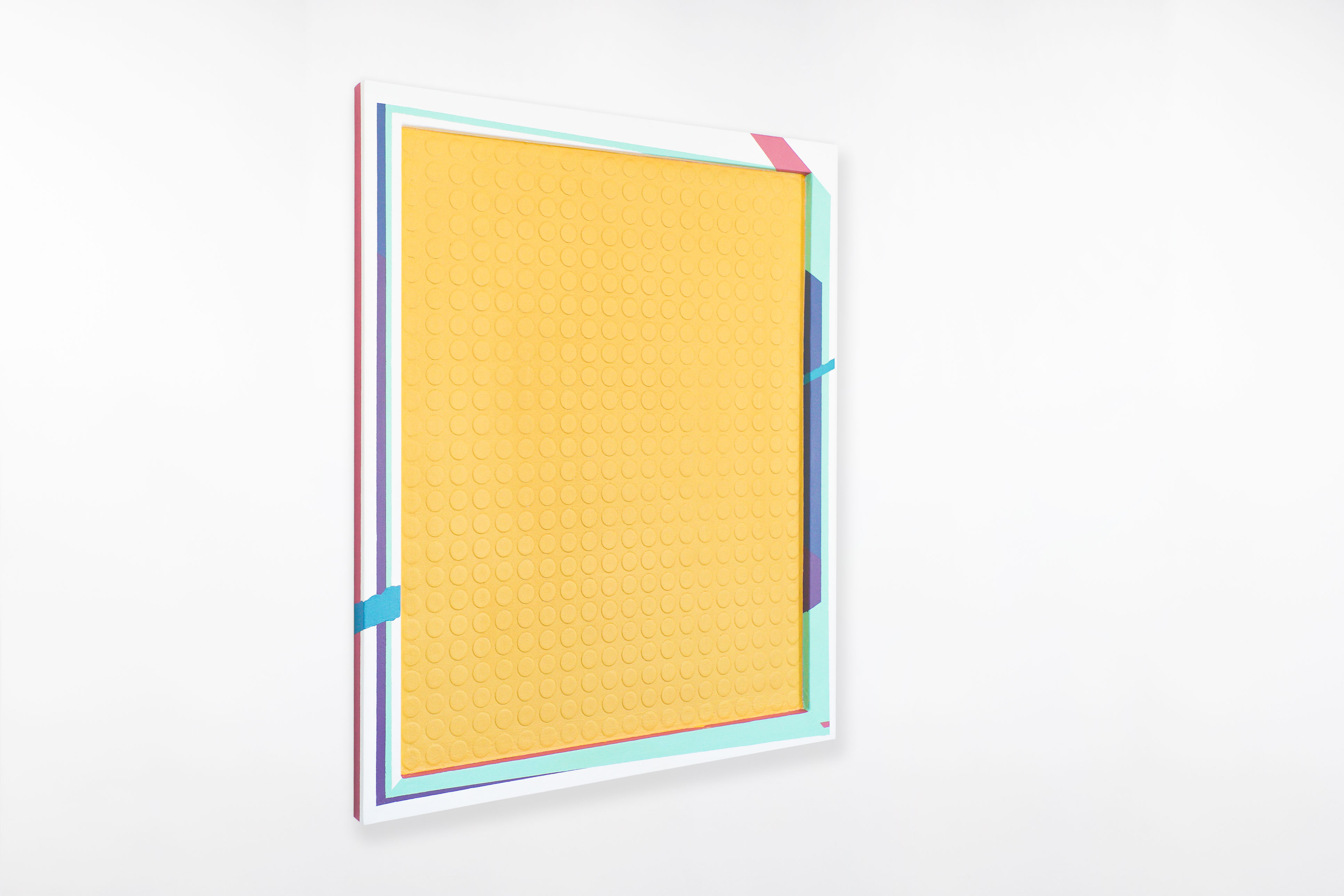 Angled view of a contemporary painting by Cameron Hunt featuring a textured yellow surface with evenly spaced circular impressions, bordered by crisp geometric patterns in teal, pink, purple, and blue.