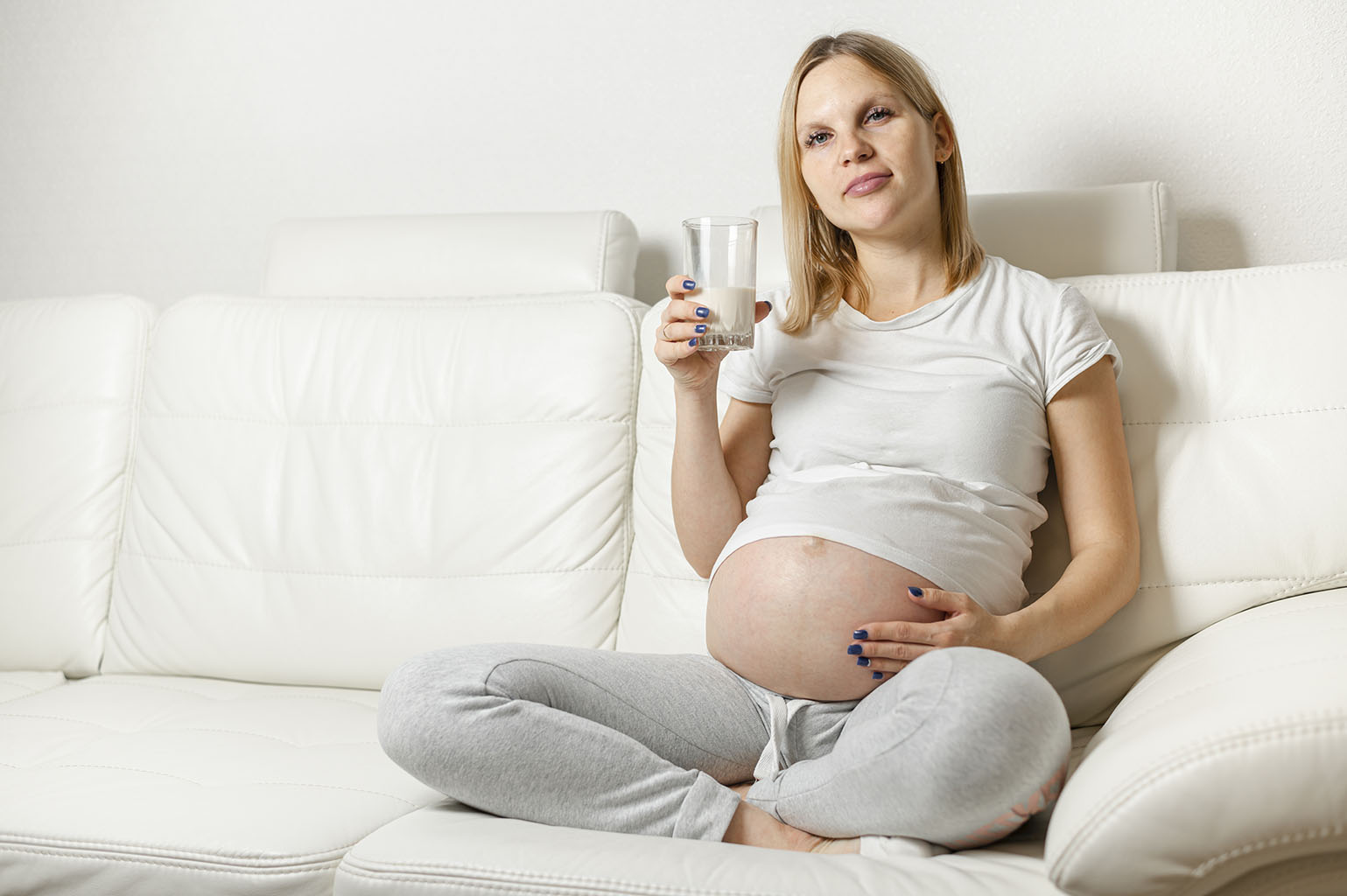 Pregnant woman enjoying pure, filtered water.