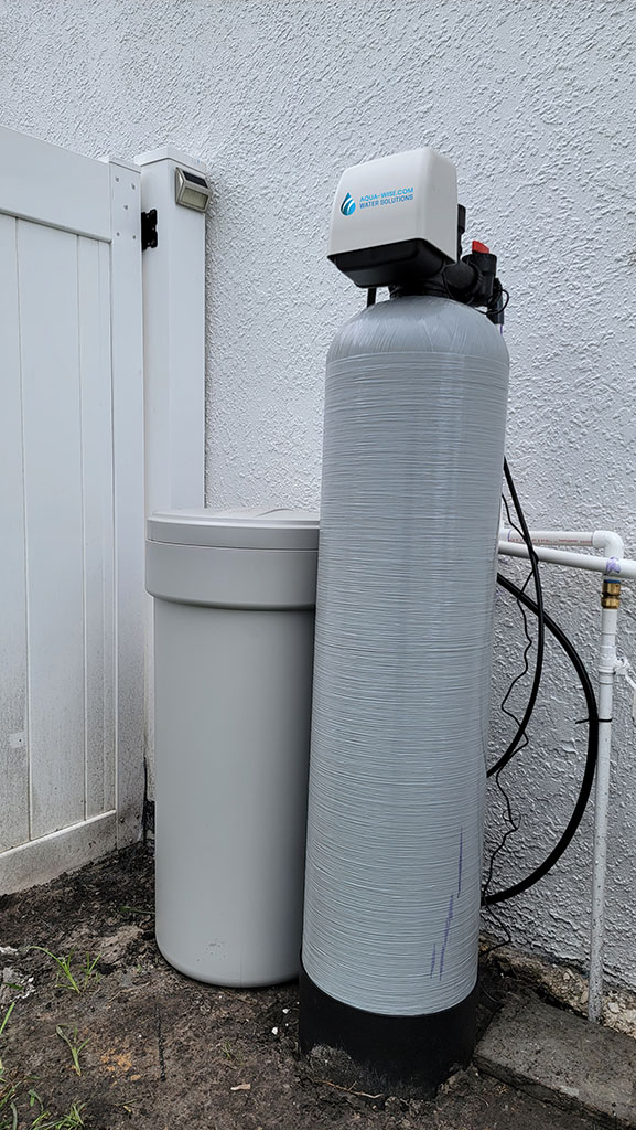 Modern water softener system installation in Sarasota home kitchen