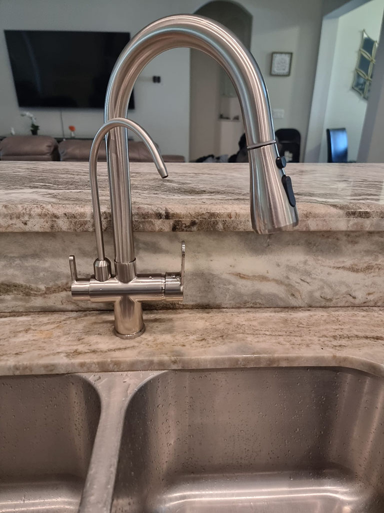 Clean water flowing from a tap with an advanced filtration system.