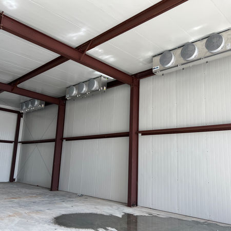 interior of a refrigerated warehouse with evaporators in view